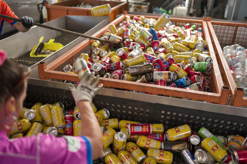 A large pile of aluminium drink cans.