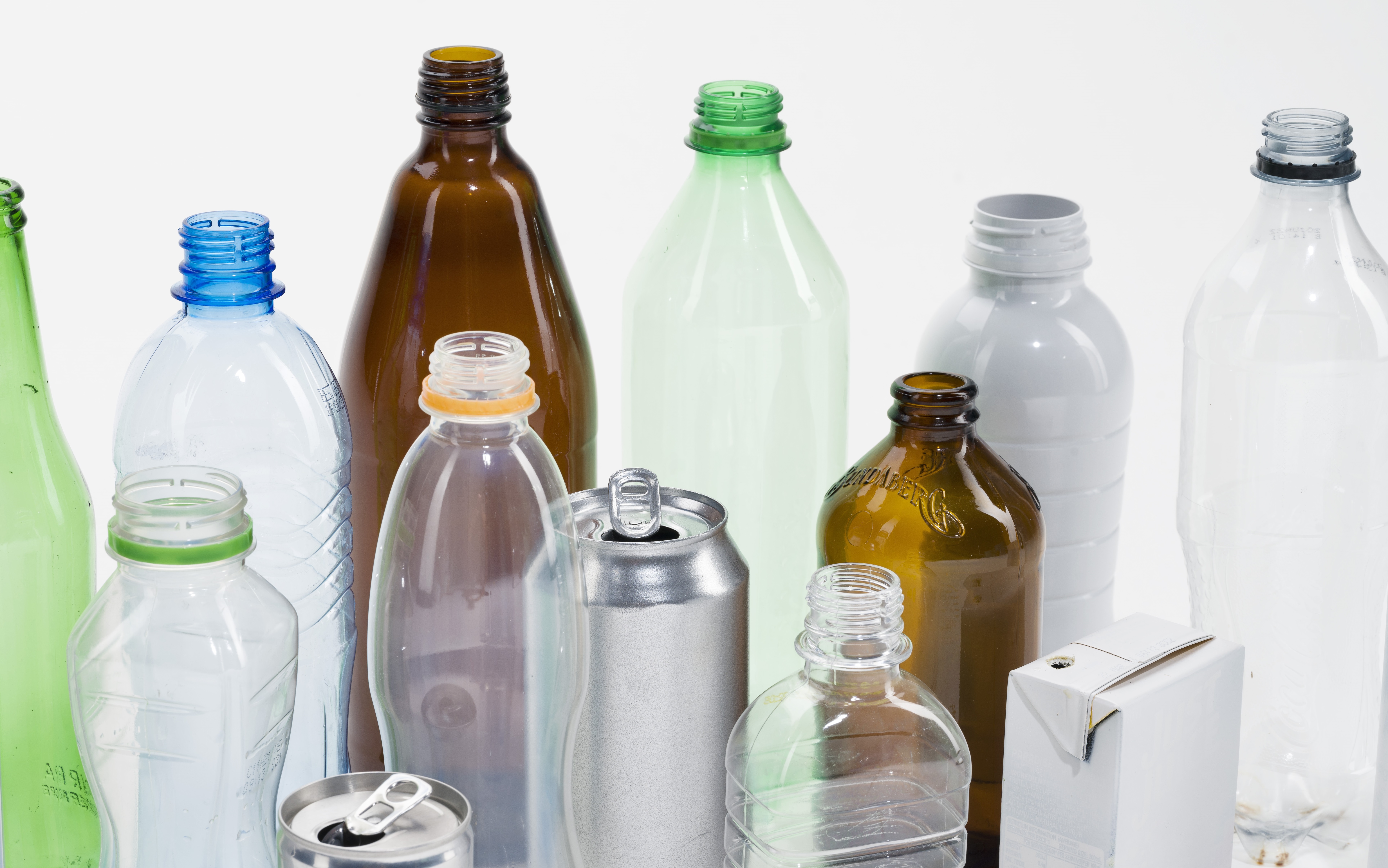 Assorted empty glass, plastic, aluminium and carton beverage containers.