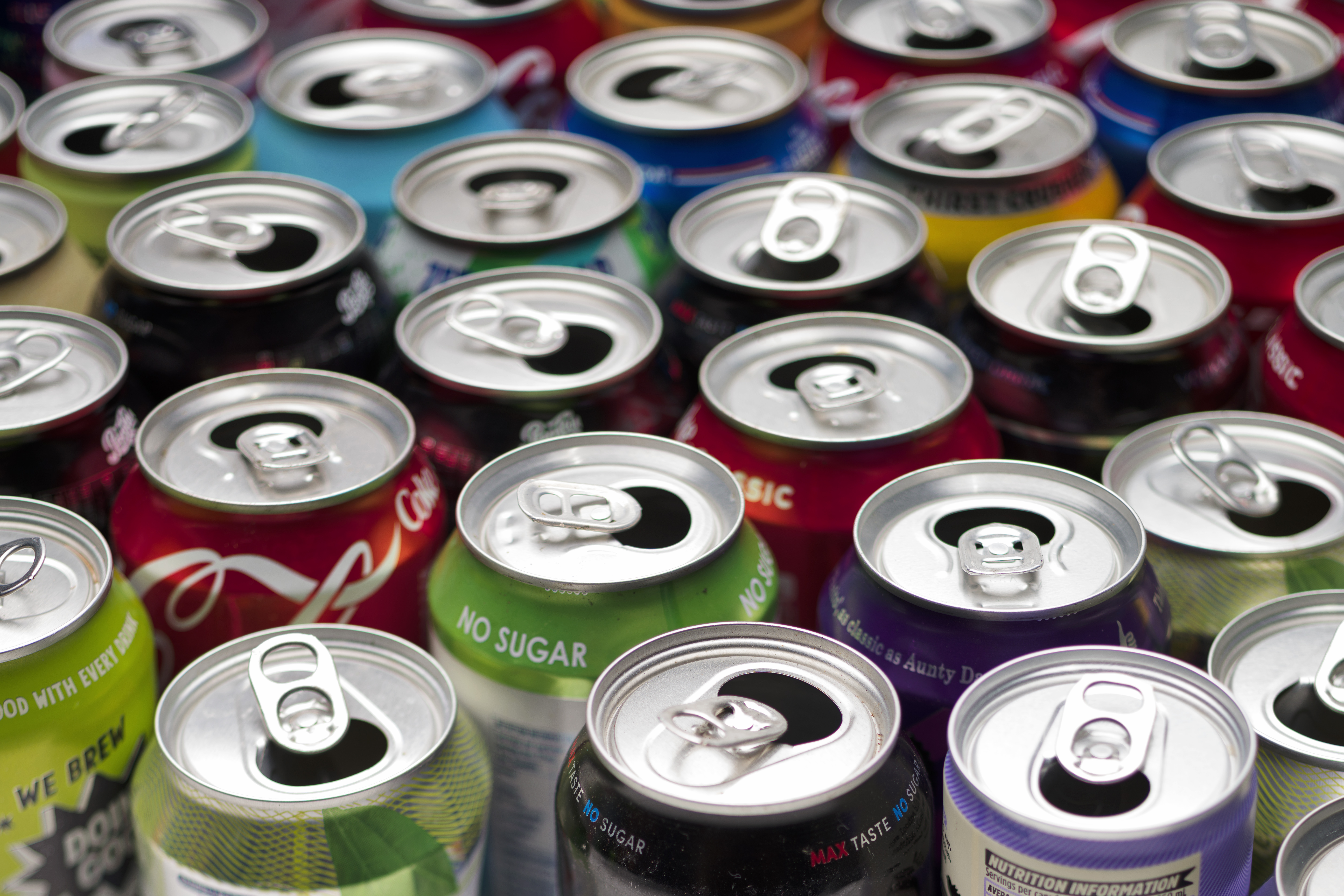 Collection of aluminium beverage cans ready for container recycling.
