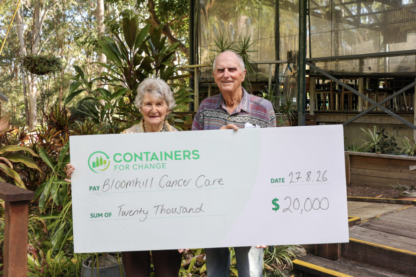 John and Yvonne Tagg holding a Containers for Change cheque for $20,000 made out to Bloomhill Cancer Care.
