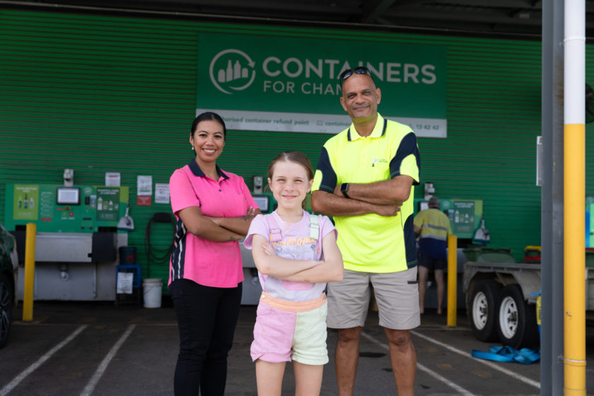 Manaia Arbuckle standing with Aprilla O’Brien and Laval Seeborun from Cairns Recycling at a Containers for Change refund point.
